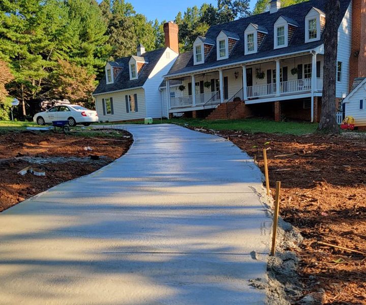 fresh concrete poured on an ongoing construction of a driveway of a villa